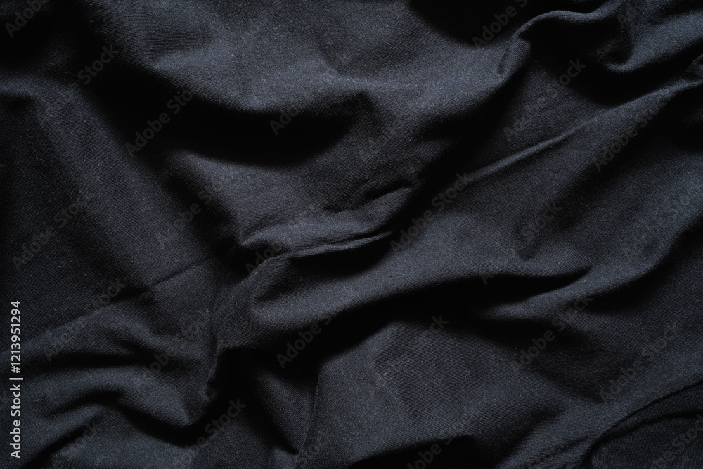Fototapeta premium Deep Black Fabric with Dramatic Drapes and Shadows