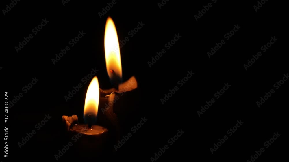 Flames of two burning candles and black wax drips in the dark.Black candles on a black background.Magical and witchcraft atmosphere. Symbol of sorrow.Dark mood. 4k Flames of two burning candles and black wax drips in the dark.Black candles on a black background.Magical and witchcraft atmosphere. Symbol of sorrow.Dark mood. 4k