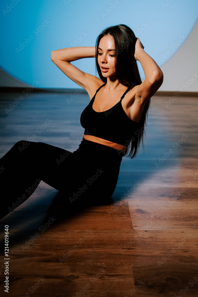 Fototapeta premium Fitness enthusiast practicing core exercises in a well-lit studio during a fitness session
