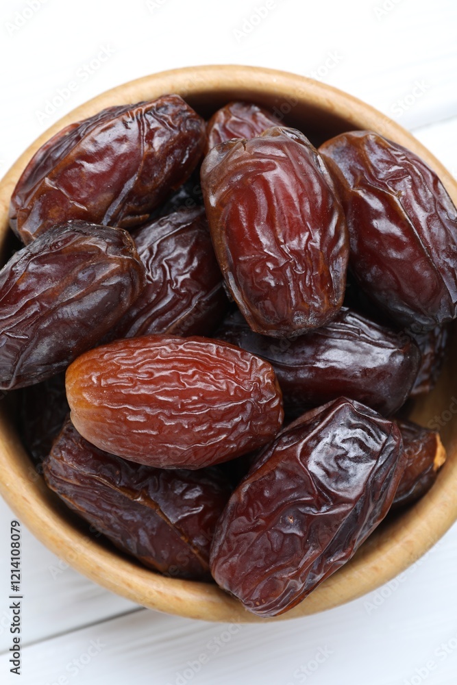 Tasty dried dates on white table, top view Tasty dried dates on white table, top view