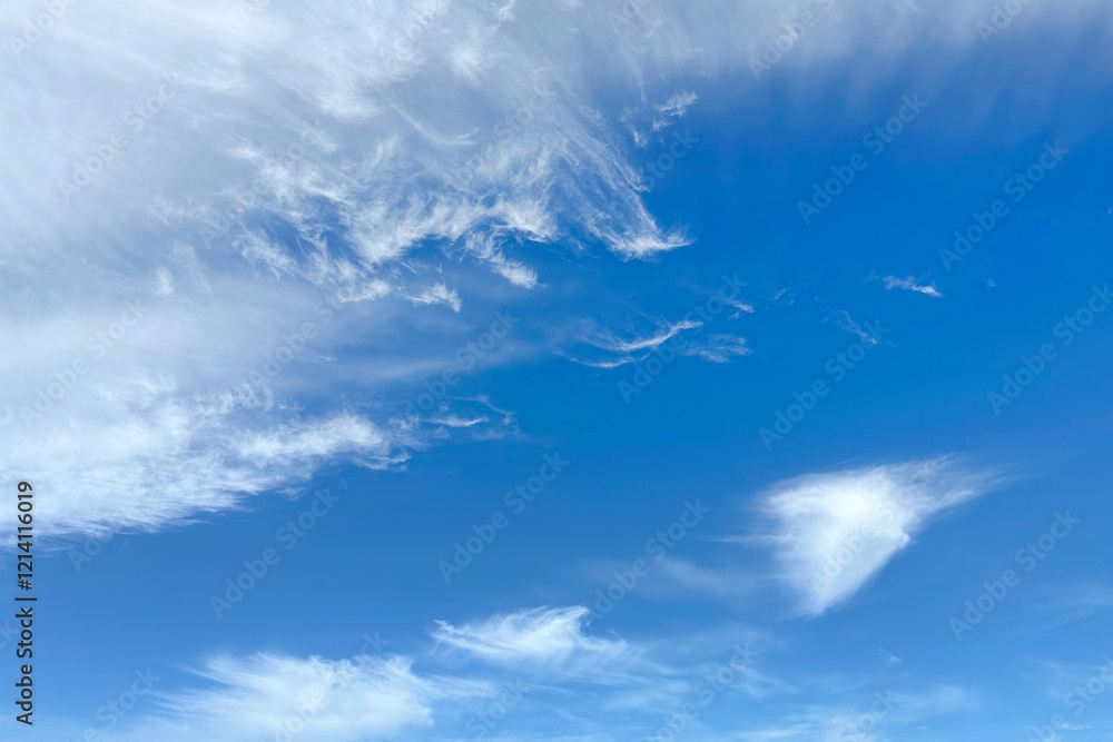 Beautiful blue sky with a light white cloudy haze. Background, backdrop, screen, desktop. Beautiful blue sky with a light white cloudy haze. Background, backdrop, screen, desktop.