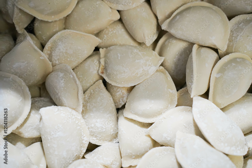 Raw dumplings with meat. dumplings with meat. frozen dumplings with meat. A lot of dumplings.