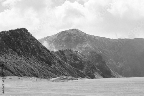 Black and white view of Bromo Tengger Semeru National Park. Clear sky is illuminating the ridge of the hills photo