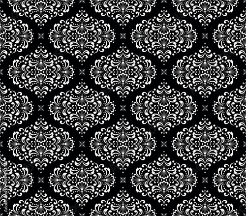 Wallpaper in the style of Baroque. Seamless vector background. White and black floral ornament. Graphic pattern for fabric, wallpaper, packaging. Ornate Damask flower ornament.