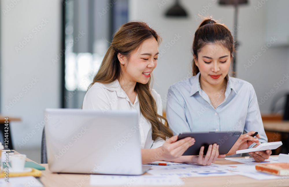 Asian Business women using calculator and laptop for doing math finance on an office desk, tax, report, accounting, statistics, and analytical research concept
Asian Business women using calculator and laptop for doing math finance on an office desk, tax, report, accounting, statistics, and analytical research concept