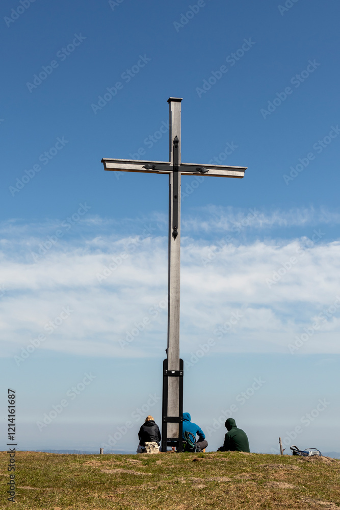 Summit cross of Rechelberg mountain in springtime, Bavaria, Germany Summit cross of Rechelberg mountain in springtime, Bavaria, Germany