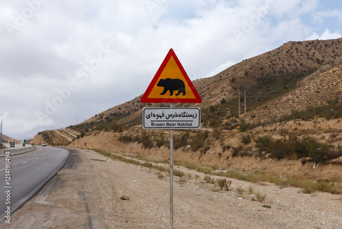 A sign warns motorists of the presence of brown bears in their habitat along the Gorgan Bojnord road within Golestan National Park. Iran