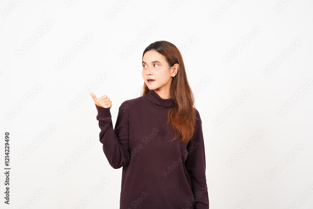 Smiling and Pointing side using thumb for copyspace Smiling and Pointing side using thumb for copyspace