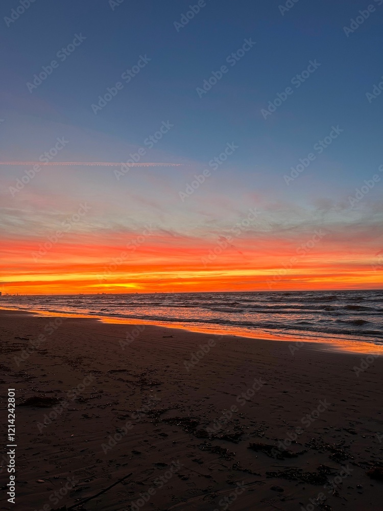 Sunset over serene beach with vibrant sky. Sunset over serene beach with vibrant sky.