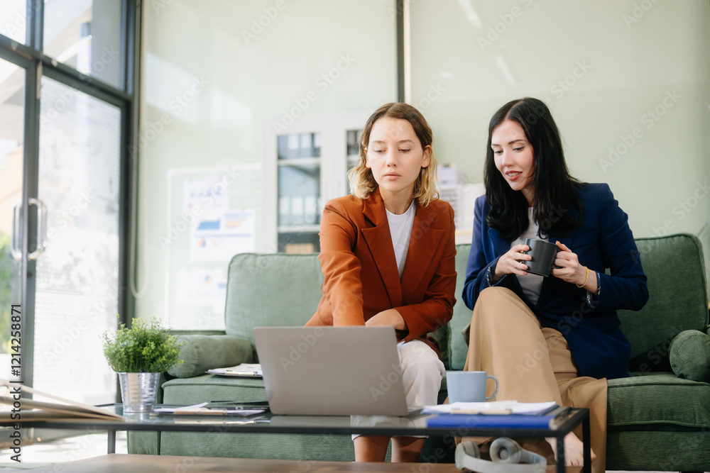 Two businesswomen strategizing with a tablet in a professional office. Highlight teamwork, leadership, Two businesswomen strategizing with a tablet in a professional office. Highlight teamwork, leadership,