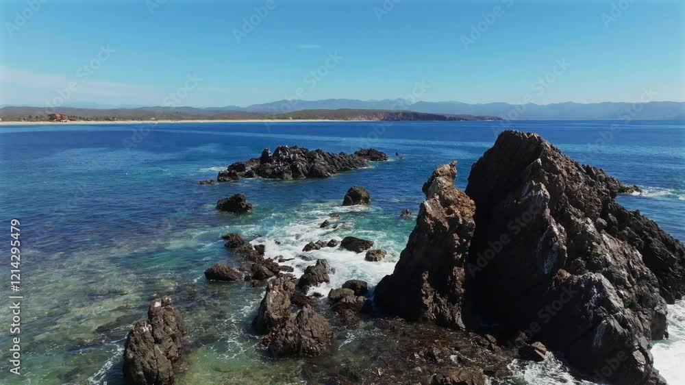 Aerial view of rocky ocean barrier and coral reefs at low tide near Tenacatita beach, La Morita beach peninsula, Jalisco Costa Alegre, Mexico Aerial view of rocky ocean barrier and coral reefs at low tide near Tenacatita beach, La Morita beach peninsula, Jalisco Costa Alegre, Mexico