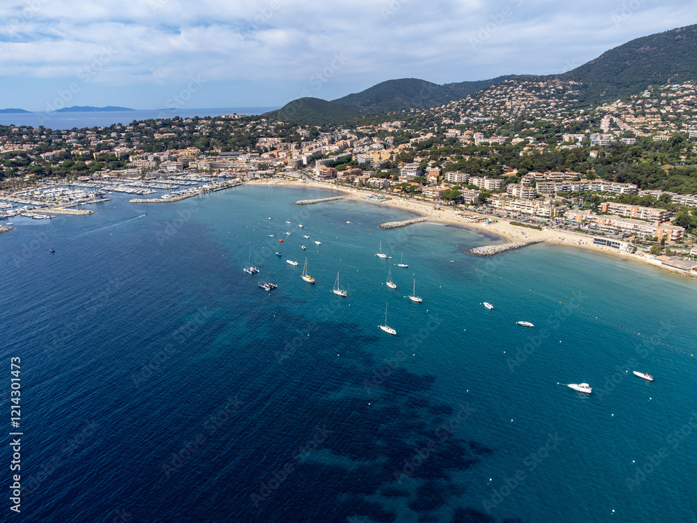 Aerial view on boats, crystal clear blue water of Plage du Debarquement white sandy beach near Cavalaire-sur-Mer and La Croix-Valmer, summer vacation on French Riviera, Var, France Aerial view on boats, crystal clear blue water of Plage du Debarquement white sandy beach near Cavalaire-sur-Mer and La Croix-Valmer, summer vacation on French Riviera, Var, France