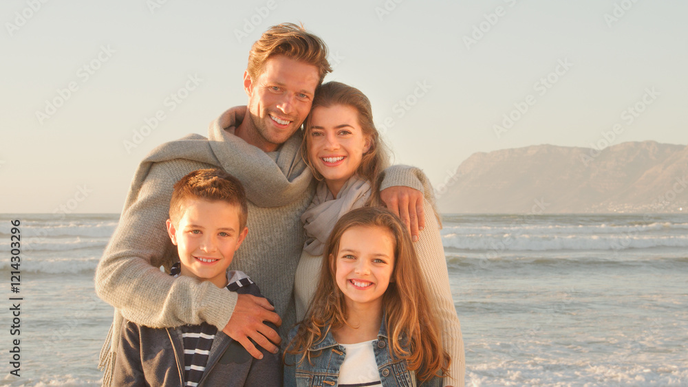 Portrait Of Smiling Family Walking Along Winter Beach Together In Golden Light Portrait Of Smiling Family Walking Along Winter Beach Together In Golden Light