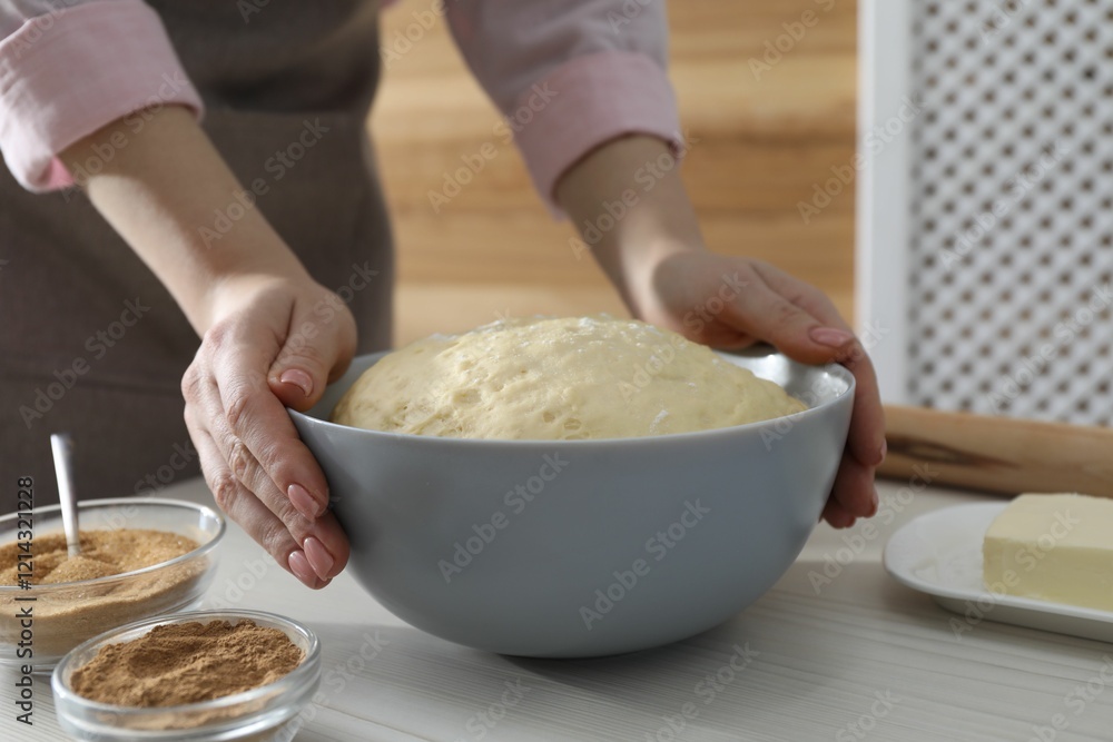 Making cinnamon rolls. Woman with dough at white wooden table, closeup Making cinnamon rolls. Woman with dough at white wooden table, closeup