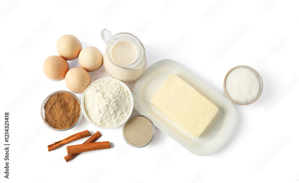 Making cinnamon rolls. Different ingredients for dough isolated on white, top view Making cinnamon rolls. Different ingredients for dough isolated on white, top view