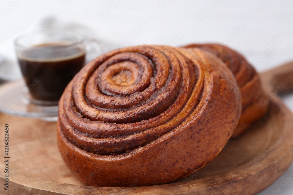Fototapeta premium Delicious cinnamon roll on white table, closeup