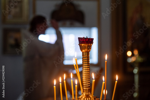 Bishop sings a prayer in church.