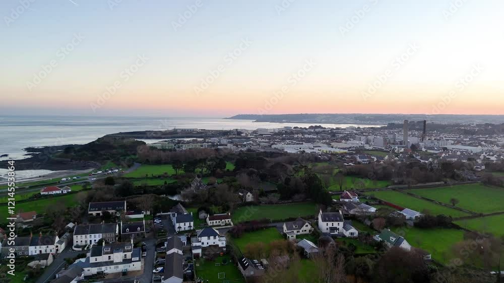 Coastal Town at Sunset with Industrial Buildings and Green Fields, Guernsey 8 Coastal Town at Sunset with Industrial Buildings and Green Fields, Guernsey 8