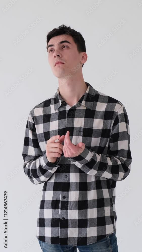 Confused young adult Caucasian man in doubt planning or solving problem on white background. Concept of an imagination and brainstorm. Vertical video. Confused young adult Caucasian man in doubt planning or solving problem on white background. Concept of an imagination and brainstorm. Vertical video.