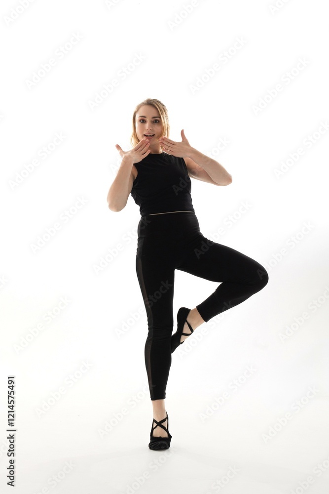 Dancer performing an expressive pose in a studio setting during a dance rehearsal session Dancer performing an expressive pose in a studio setting during a dance rehearsal session