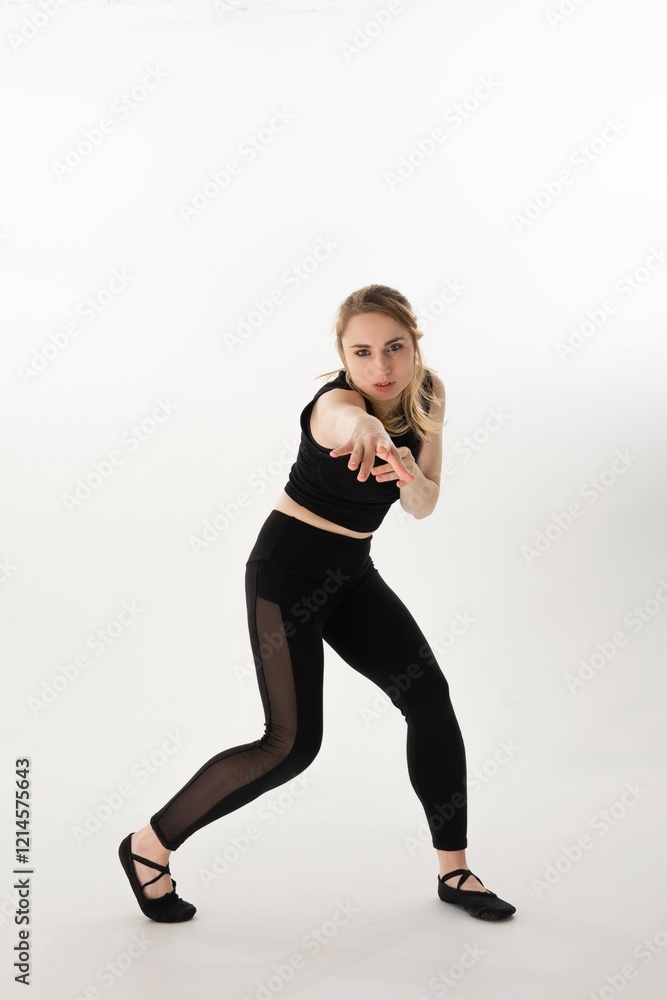 Dancer showcases elegant movement in a minimalist studio setting during an expressive performance Dancer showcases elegant movement in a minimalist studio setting during an expressive performance