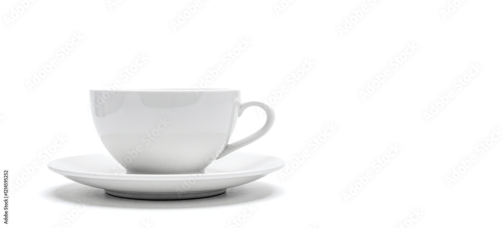Obraz premium Elegant white ceramic cup on matching saucer isolated on white background. beverage drink concepts, tea time