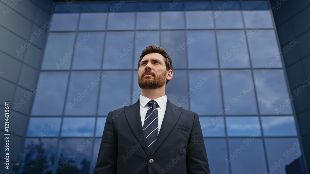 Confident ceo looking ahead in front glass office showing determination closeup. Confident ceo looking ahead in front glass office showing determination closeup.
