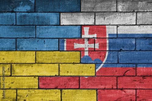 Photography colourful painted big flag of ukraine and flag of slovakia on a massive old brick wall background