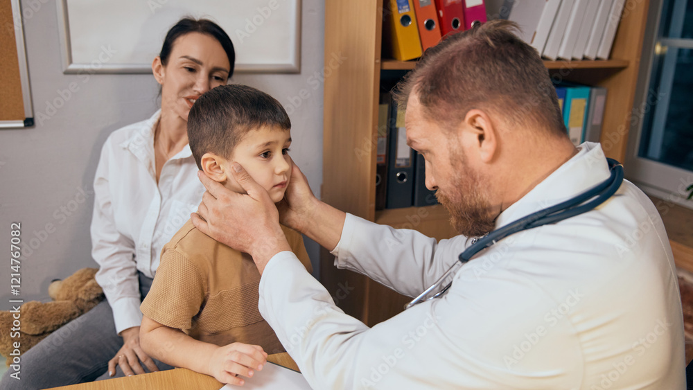 Obraz premium Male doctor inspecting young boy neck, lymph nodes with both hands during medical consultation. Attentive mother sitting in background. Concept of health care, medicine, treatment