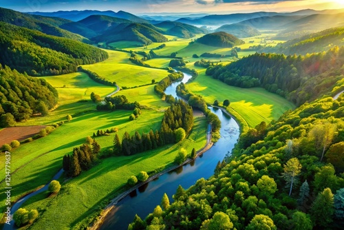 Breathtaking Aerial Drone Shot: Meandering River in Lush Green Valley