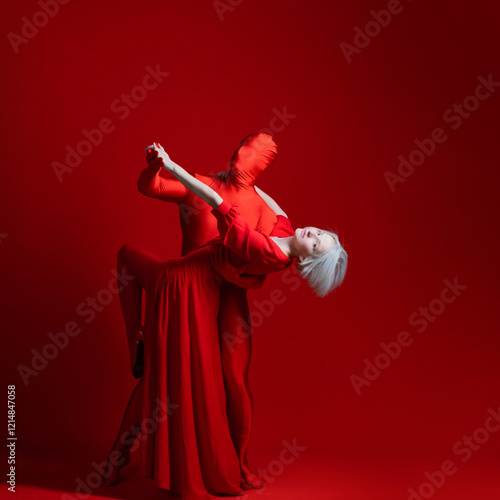 Accept yourself, the concept, dance with your secret strange sides of personality, a woman in a red dress dancing with a red man on a red background photo