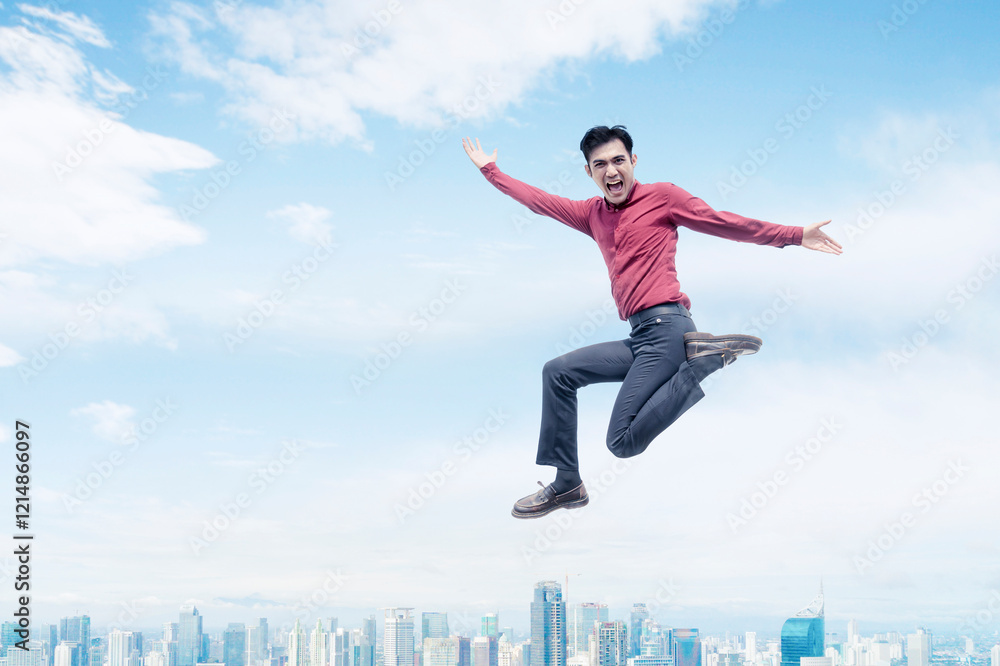 Energetic Young Man Leaping Above City Skyline Energetic Young Man Leaping Above City Skyline