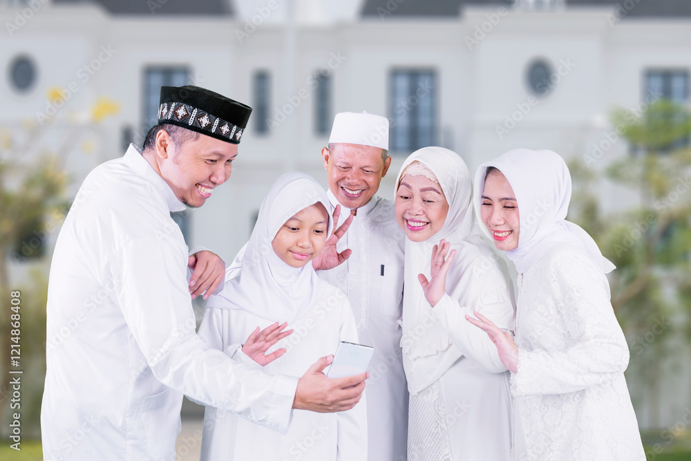 Happy Muslim Family Celebrating and Connecting Virtually Together Happy Muslim Family Celebrating and Connecting Virtually Together