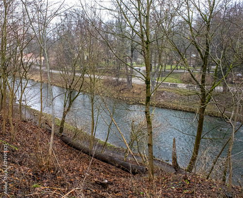 View of Vilnia river in a cloudy and foggy winter day as seen from Uzupis  neighborhood in Old Town Vilnius, Vilnius, Lithuania 