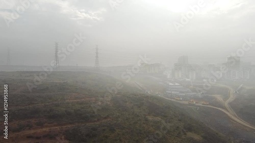 Aerial shot of construction work next to a valley