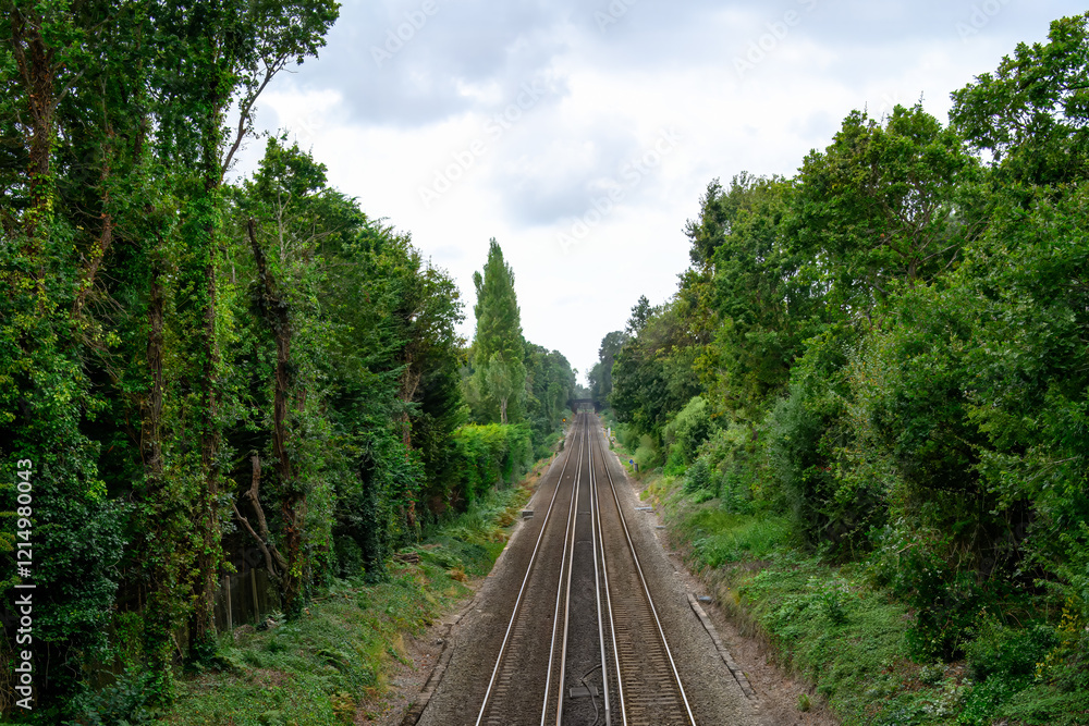 Obraz premium long straight railway track surrounded by trees Bursledon Hampshire England