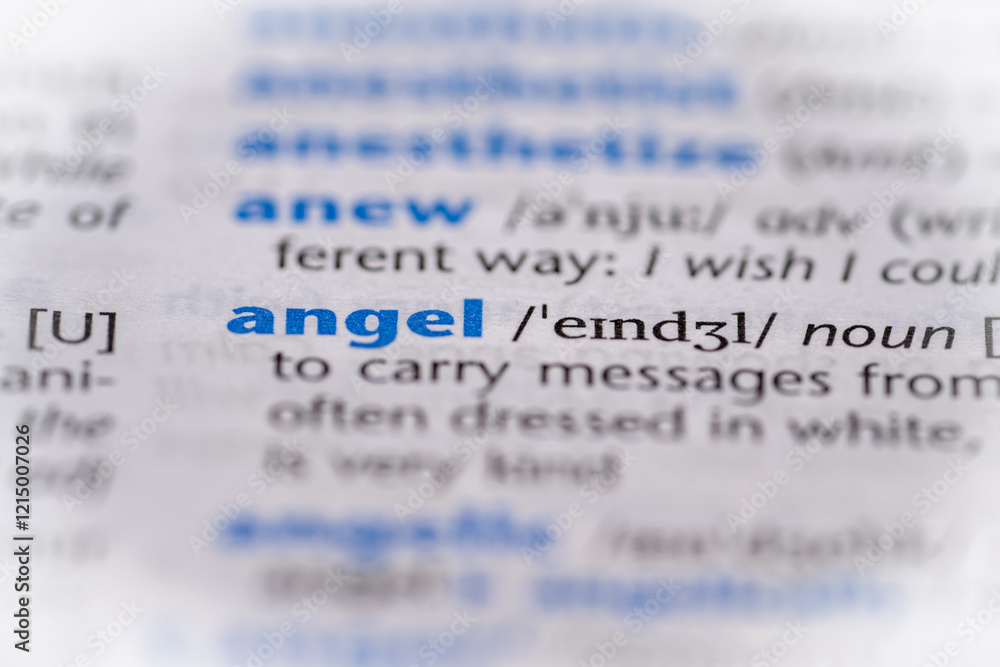 Angel word in a dictionary. Selective focus, close up. Angel word in a dictionary. Selective focus, close up.