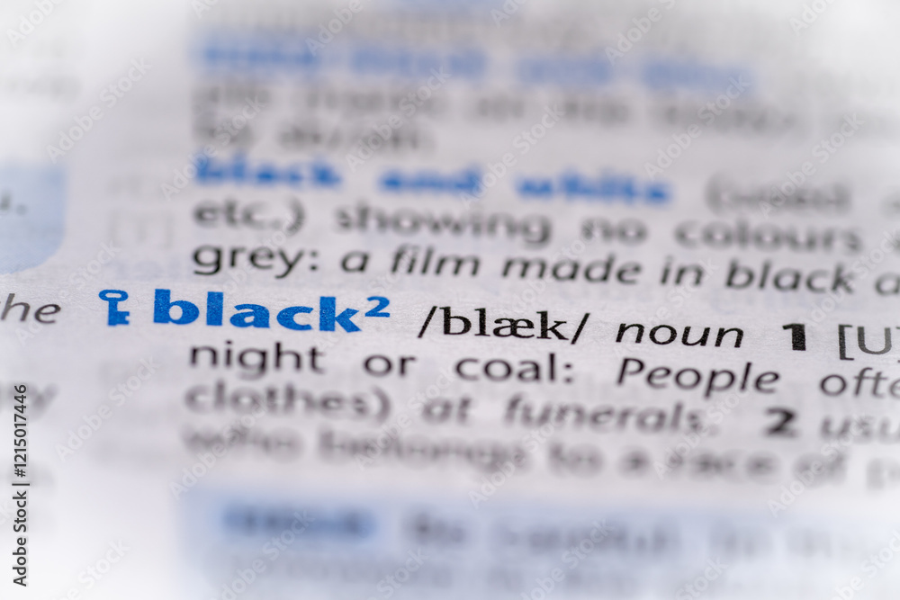 Black word in a dictionary. Selective focus, close up. Black word in a dictionary. Selective focus, close up.