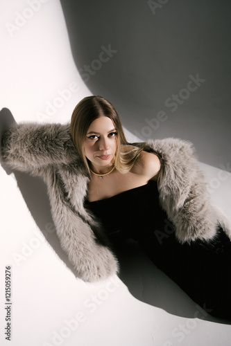 Obraz na płótnie Portrait of a woman in a studio with professional lighting in a smart dress with gloves and a fur coat w salonie