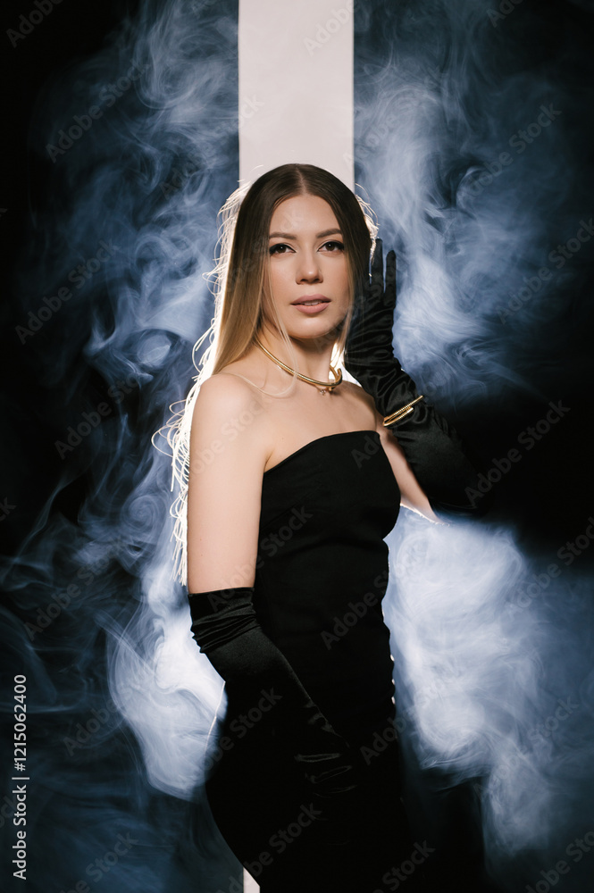 Portrait of a woman in a studio with professional light and smoke in a smart dress with gloves