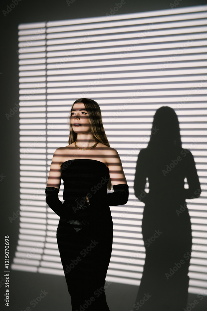 Portrait of a woman in a studio with professional lighting in a smart dress with gloves