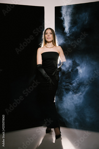 Obraz na płótnie Portrait of a woman in a studio with professional light and smoke in a smart dress with gloves w salonie