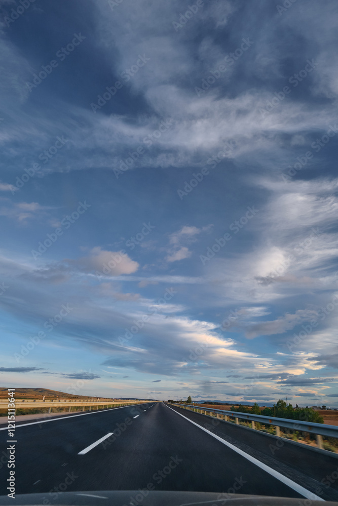 Highway stretching into the horizon, beautiful sky Highway stretching into the horizon, beautiful sky