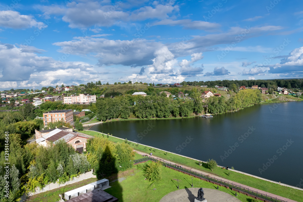 Naklejka premium Nevyansk, Sverdlovsk region,. View of the city of Nevyansk, Monument to Peter I and Nikita Demidov and with the shadow of the inclined Demidov tower on a summer day