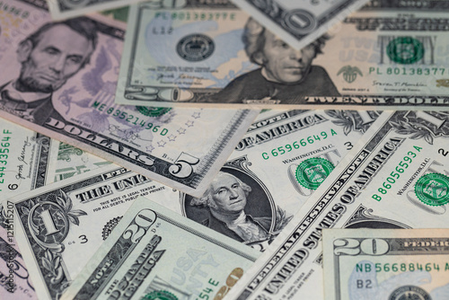 different US dollar banknotes background