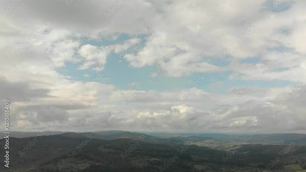 Aerial View Of Majestic Mountains With Forested Slopes, Flying Near Clouds On A Sunny Day, Capturing The Serene Beauty Of Nature From A Bird's-Eye Perspective. Aerial View Of Majestic Mountains With Forested Slopes, Flying Near Clouds On A Sunny Day, Capturing The Serene Beauty Of Nature From A Bird's-Eye Perspective.