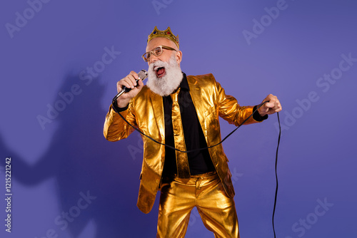 Photo portrait of fashionable old showman sing have fun microphone wear glamour golden garment isolated on violet color background photo