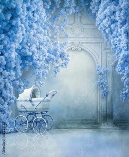 A vintage baby carriage surrounded by blue flowers in a dreamy, ethereal setting
