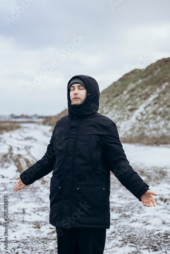 Peaceful Man Enjoying a Relaxing Winter Walk Outdoors photo