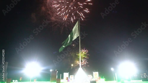 hanging Pakistan flag on firework sky bokeh background